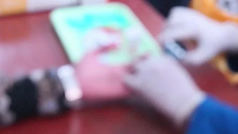 Blur defocus doktor performing a blood test (for diabetes and high cholesterol). Stock-Footage 340932805