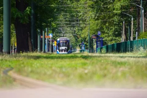 Blur, in the distance trams go in different directions on the rails in the al Stock Photos