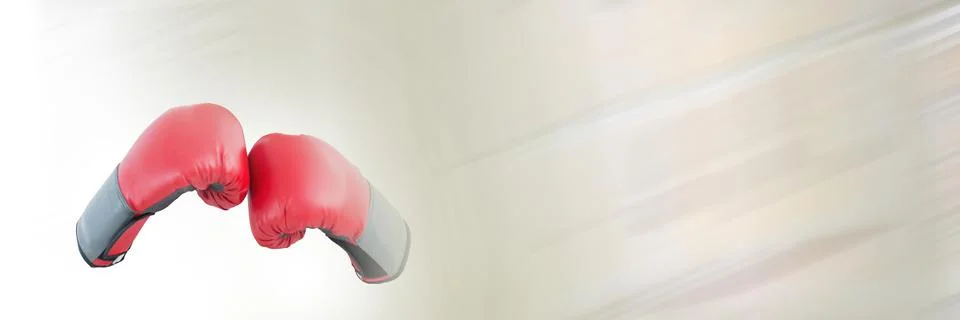 Blur effect with copy space over red boxing gloves against grey background Foto stock