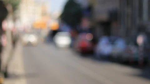 Blur effect, defocus video. City streets with cars on a sunny summer day Stock Footage 154378926