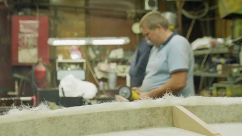 Blur of fat man working in workshop with instruments Stock Footage 99179581