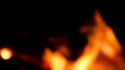 Blur fire flames on black night background with bokeh effect. Video stock 120785699