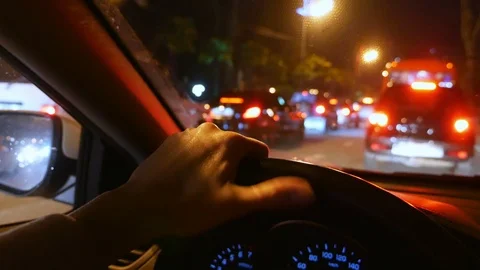 Blur, first person view. hand on the steering wheel of the car. driving in traff Video stock 106520508