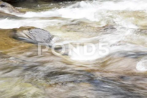 Blur of flowing waters Stock Photos