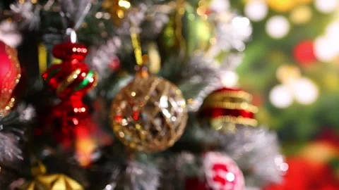 Blur to Focus Transition on Christmas Tree Ornaments with Twinkling Lights Stock Footage 291112694