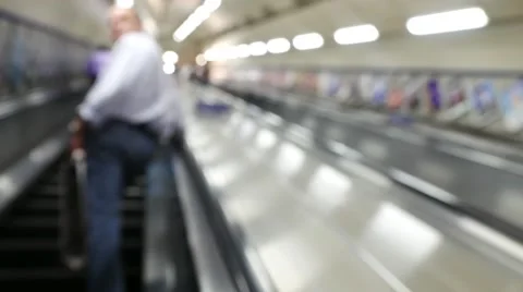 Blur footage of busy commuters on elevators of an underground station in London. Stock Footage 65007563