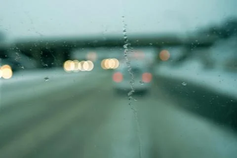 Blur image of trafic lights after snowing. Stock Photos