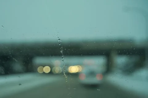 Blur image of trafic lights after snowing. Stock Photos