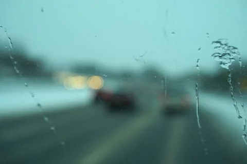 Blur image of trafic lights after snowing. Stock Photos