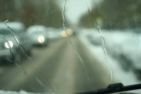 Blur image of trafic lights after snowing. Stock Photos