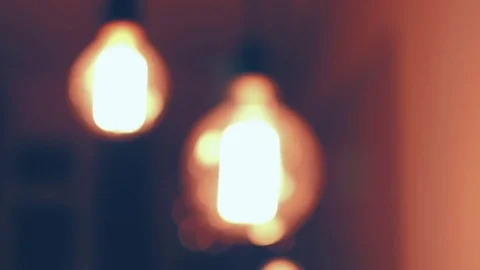 Blur light bulbs illuminates dark room Stock Footage 72709450