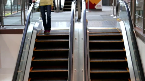 Blur motion of people taking escalator at Pan Pacific Vancouver hotel. Stock Footage 63392909