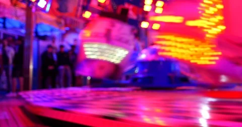 Blur night a illuminating red light at Octopus or Breakdance amusement ride. Stock Footage 113704561