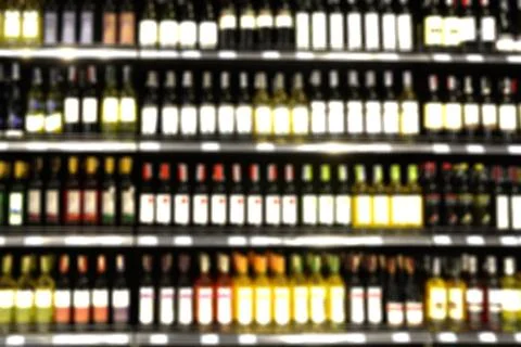 Blur or Defocus image of Wine on the Shelf of Liquor Store Stock Photos