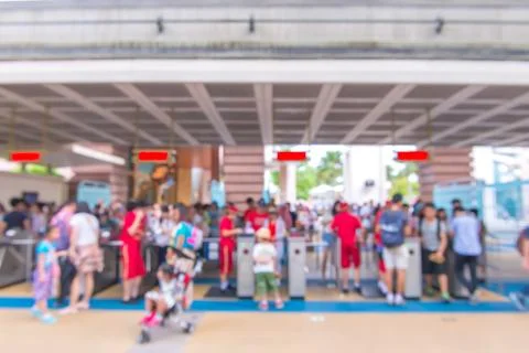 Blur people at queue in front of exhibition gate, abstract blurred background Foto stock