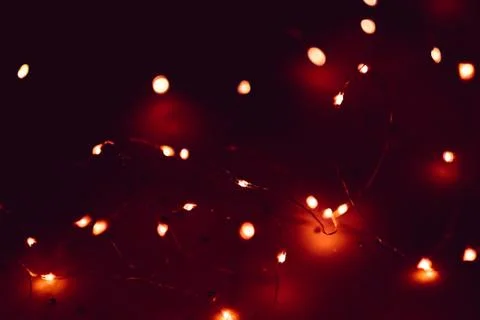 Blur red lights led string dark maroon background Stock Photos
