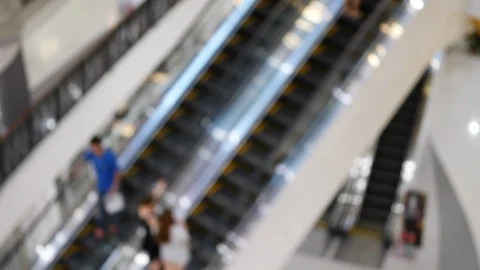 Blur scene, people using escalator in shopping mall Stock Footage 93588277