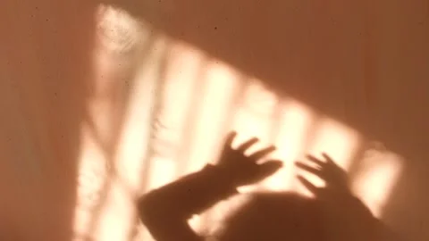 Blur shadows of child hands on wall. Game with light and shadow. Shadow play Stock Footage 151997871