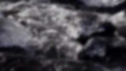 Blur stream running through stone Stock Footage 256087135