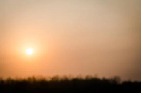 Blur sunset in the field. Stock Photos