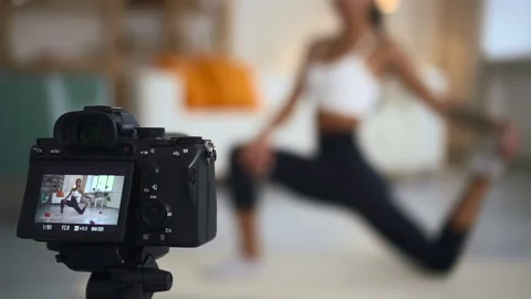 Blur view of camera shooting as female athlete doing exercise in apartment room. Stock Footage 158361331
