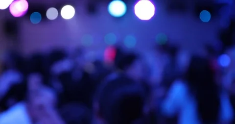 Blured background of people dancing at Party in Night Club, Blured Bokeh Stock Footage 100386666