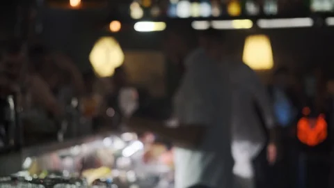 Blured barmans work at the bar and pour drinks into glasses Stock Footage 121804797