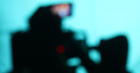 Blured Cameramen silhouette Stock Footage 335693714