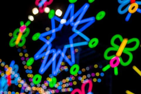 Blured Multi-colored neon lights at night. Stock Photos