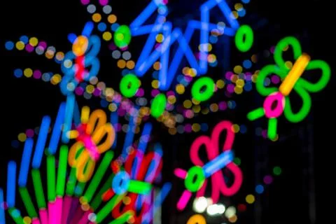 Blured Multi-colored neon lights at night. Stock Photos