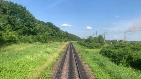 Blured side view of high-speed turning end back of train on landscape of Stock Footage 159444089