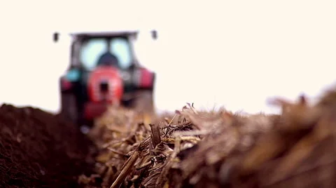 Blured tractor plowing field Stock Footage 48846448