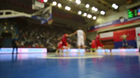 Blured view to players playing basketball at court Stock Footage