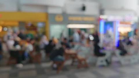 Blurred abstract background of a crowded shopping mall food court Video stock 343420308