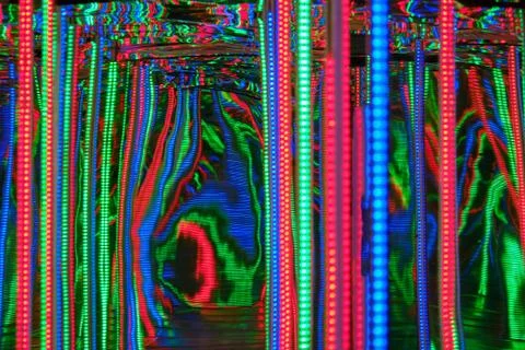Blurred abstract background with path between colored lights. Stock Photos