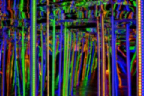 Blurred abstract background with path between the multi-colored lights Stock Photos