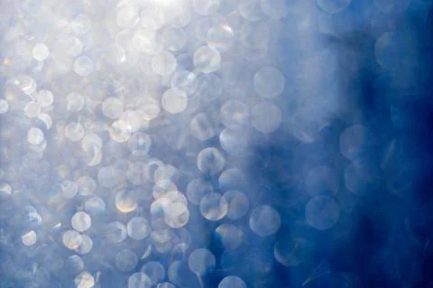 Blurred abstract blue glitter texture, defocused christmas lights. Holiday ch Stock Photos