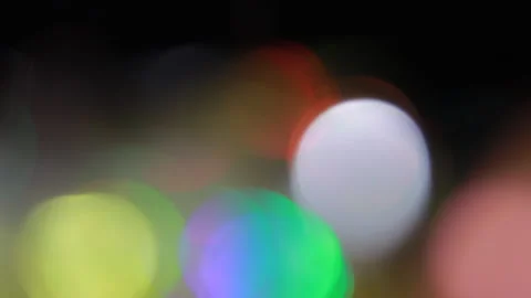 Blurred abstract bokeh of twinkling holiday lights that have lost focus 스톡 동영상 309584053