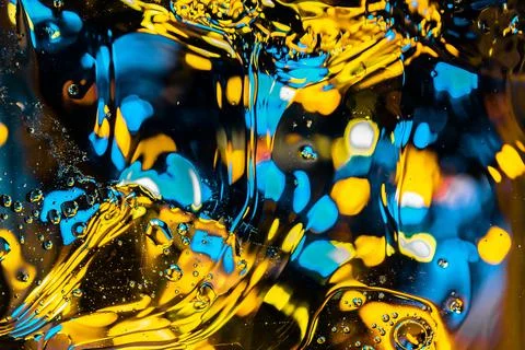 Blurred abstract fluid background with flowing big bubbles and bokeh lights o Stock Photos