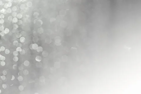 Blurred abstract glitter texture, defocused christmas silver and white lights Stock Photos