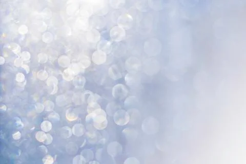 Blurred abstract glitter texture, defocused christmas silver and white lights Stock Photos