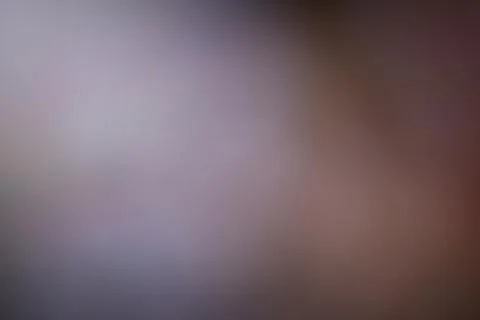 Blurred abstract gradient background with soft lighting for creative design.. Stock Photos