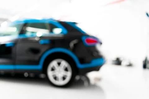 Blurred abstract image of man worker with car in a body shop. Blur car auto s Stock-Fotos