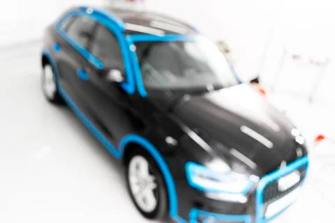 Blurred abstract image of man worker with car in body shop. Blur car auto ser Stock Photos