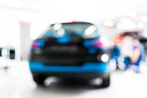 Blurred abstract image of man worker with car in body shop. Blur car auto ser Stock Photos