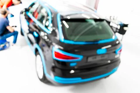 Blurred abstract image of man worker with car in body shop. Blur car auto ser Stock Photos