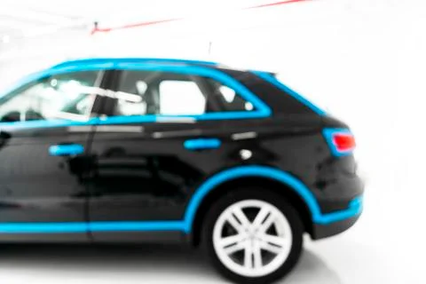 Blurred abstract image of man worker with car in body shop. Blur car auto ser Stock Photos