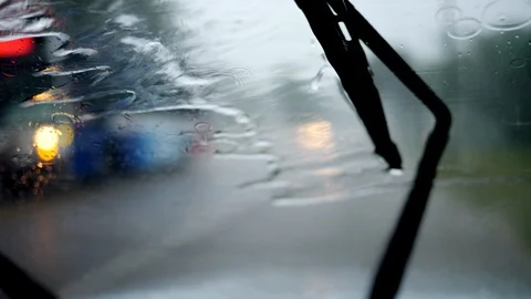 Blurred abstract view of a windshield of a car. Sitting inside the car during Video stock 109474372