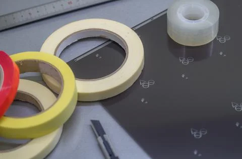 Blurred adhesive tape of different types and sizes. Transparent and colored Stock Photos