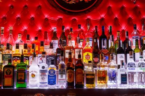 Blurred alcohol bottles on a bar Фото